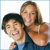 smiling teens with braces