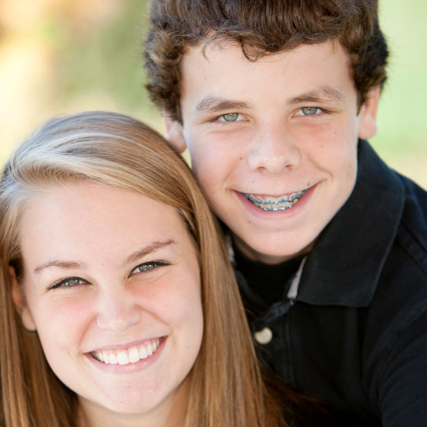 teens wearing braces Two teenagers wearing braces, smiling brightly—showcasing the beauty and confidence that come with a healthy, well-aligned smile.